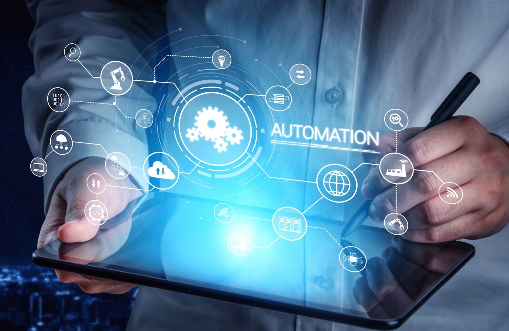 Person using a digital tablet with automation icons and technology network overlay.